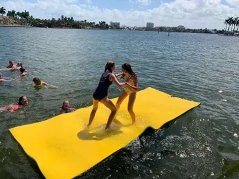 Group enjoying the sandbar with floating lily pad